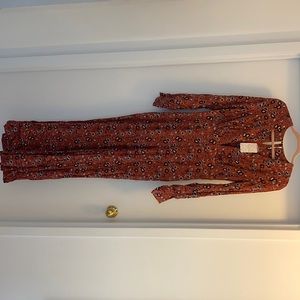 Floral free people jumpsuit! Long sleeved, flowing
